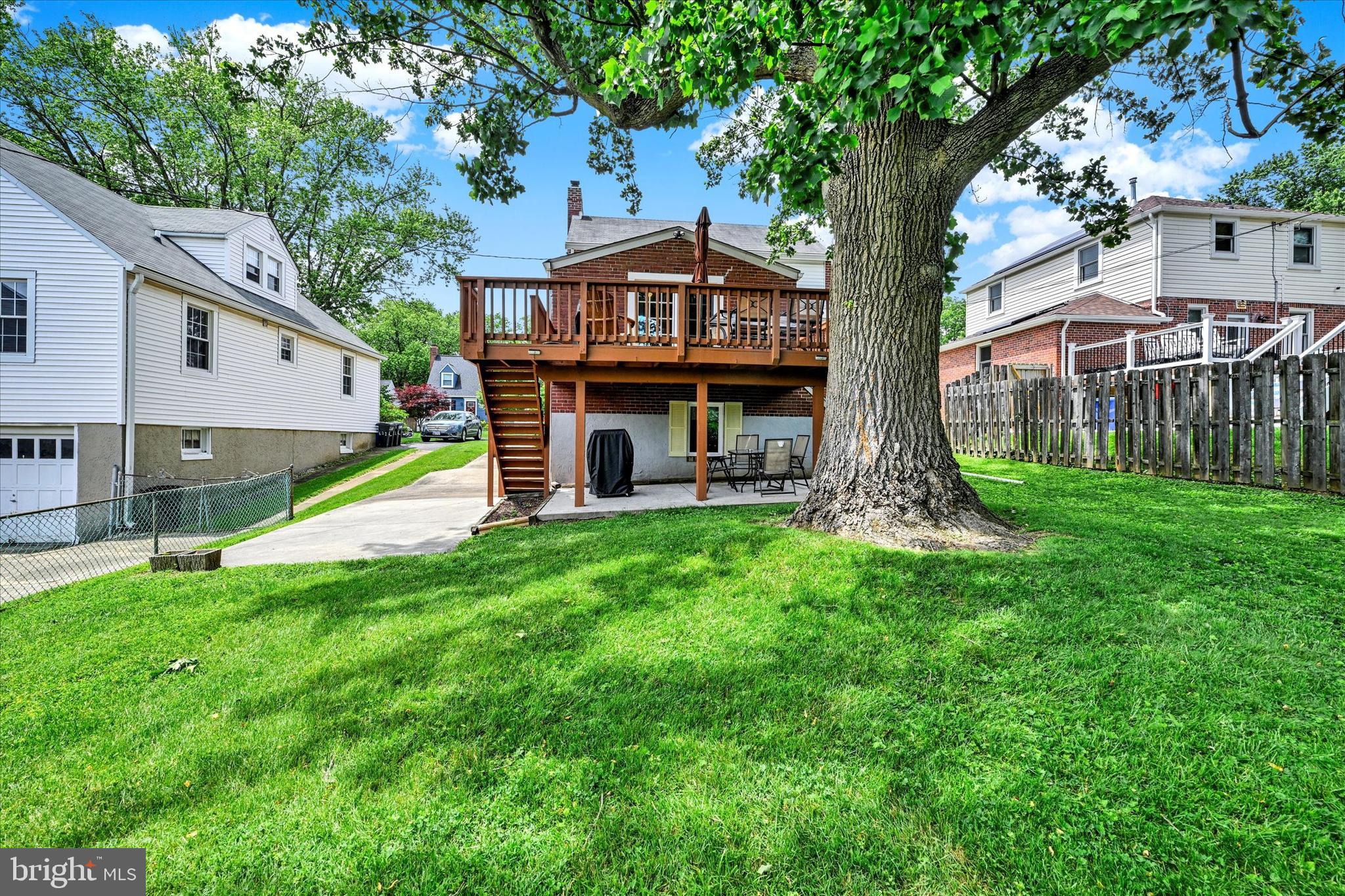 619 Warwick Road Baltimore, MD 21229 - Photo 36 of 41 a view of an house with backyard and a tree