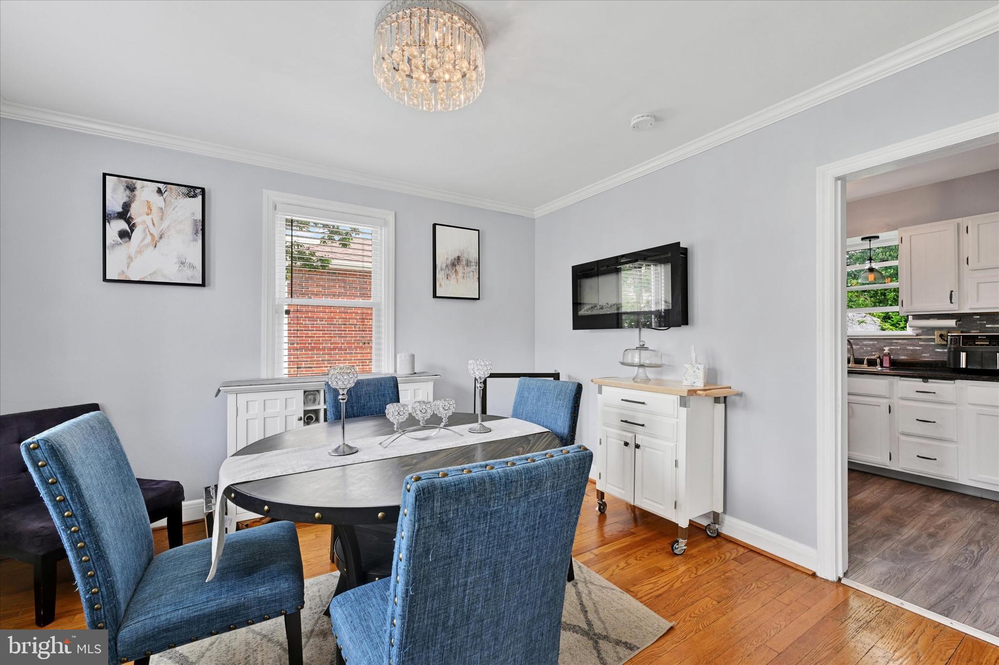 619 Warwick Road Baltimore, MD 21229 - Photo 8 of 41 a view of a dining room with furniture and wooden floor