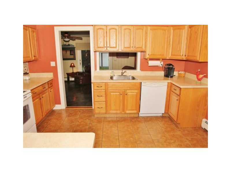 29 Riverside Lane Riverside, CT 06878 - Photo 8 of 20 a kitchen with stainless steel appliances a refrigerator a sink a stove and white cabinets