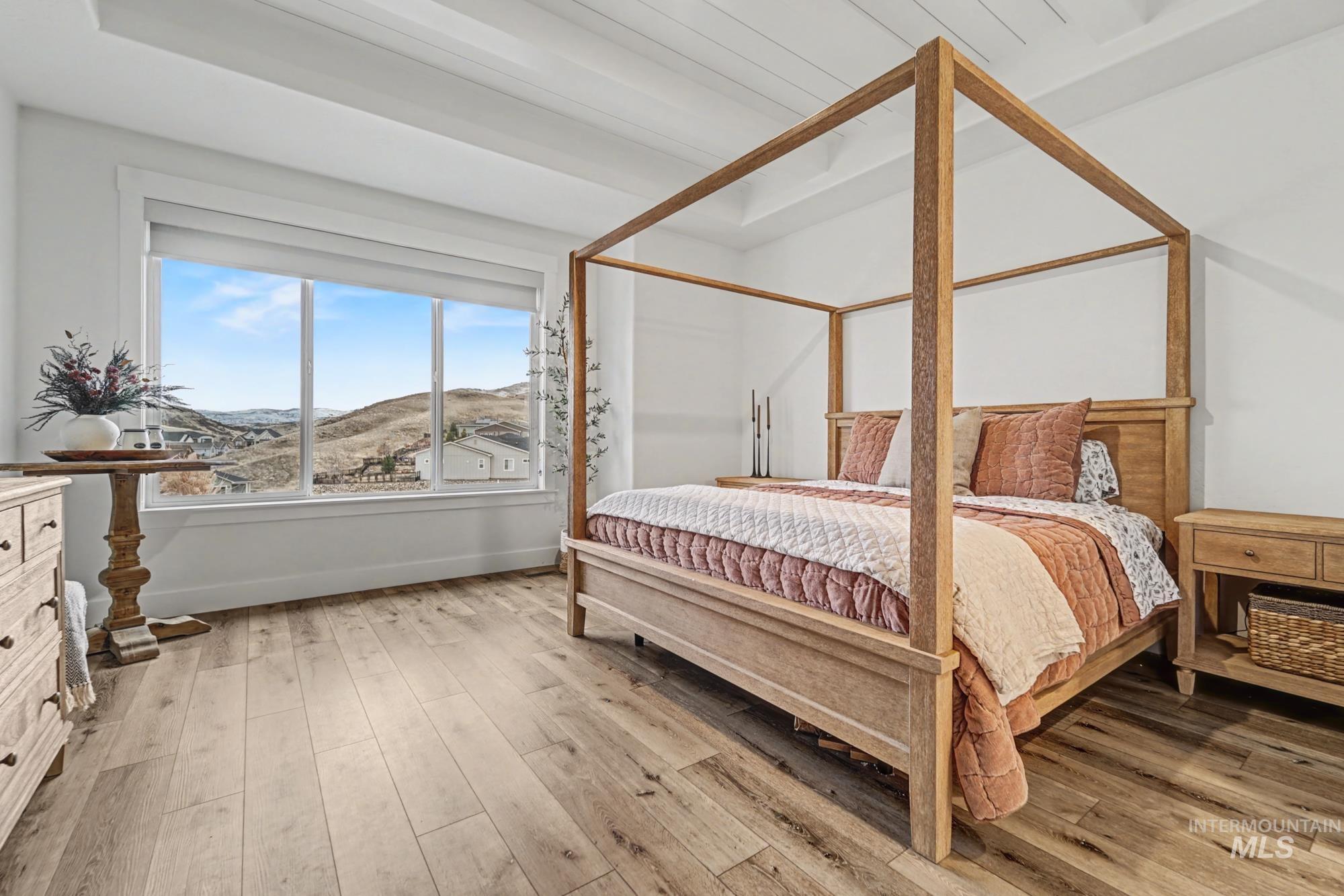 18357 North Burnt Car Way Boise, ID 83714 - Photo 19 of 48 Bedroom with a mountain view and light wood-style flooring