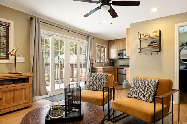 a kitchen with stainless steel appliances granite countertop white cabinets a microwave oven a sink and dishwasher