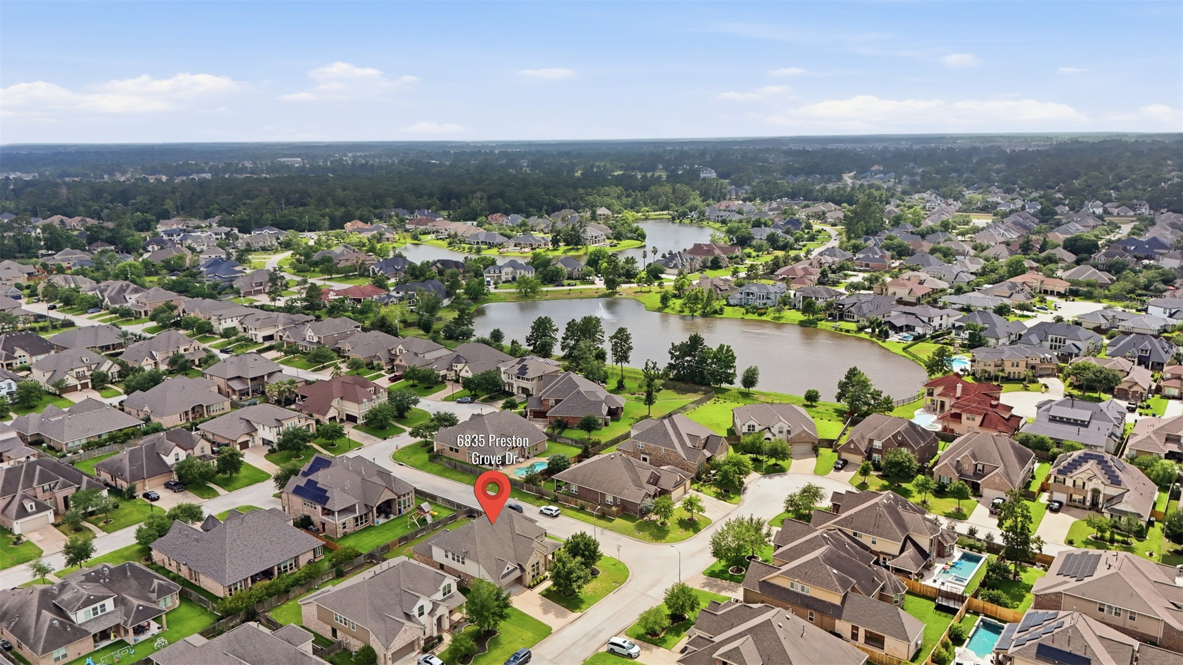 6835 Preston Grove Drive Spring, TX 77389 - Photo 45 of 49 an aerial view of city and lake