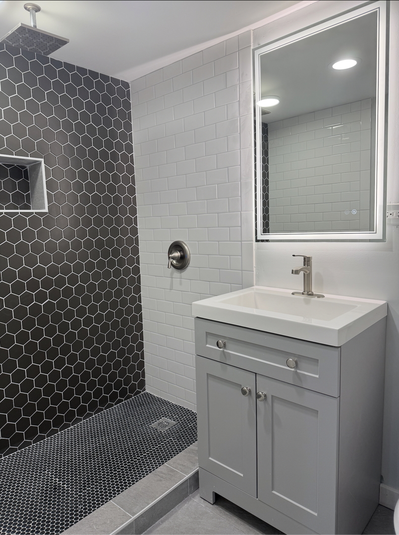 16879 Head Avenue Hazel Crest, IL 60429 - Photo 11 of 28 a bathroom with a sink a toilet and shower