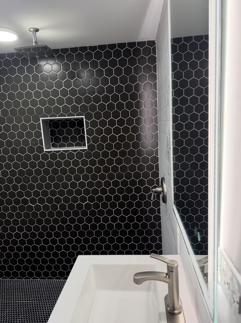 16879 Head Avenue Hazel Crest, IL 60429 - Photo 12 of 28 a bathroom with a bathtub and shower