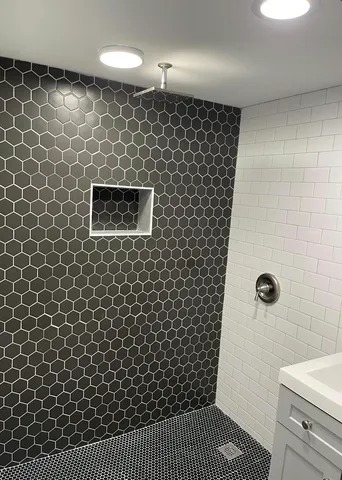 a bathroom with a shower and a toilet