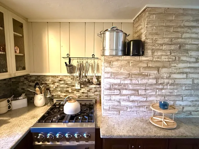 a kitchen with a stove and cabinets
