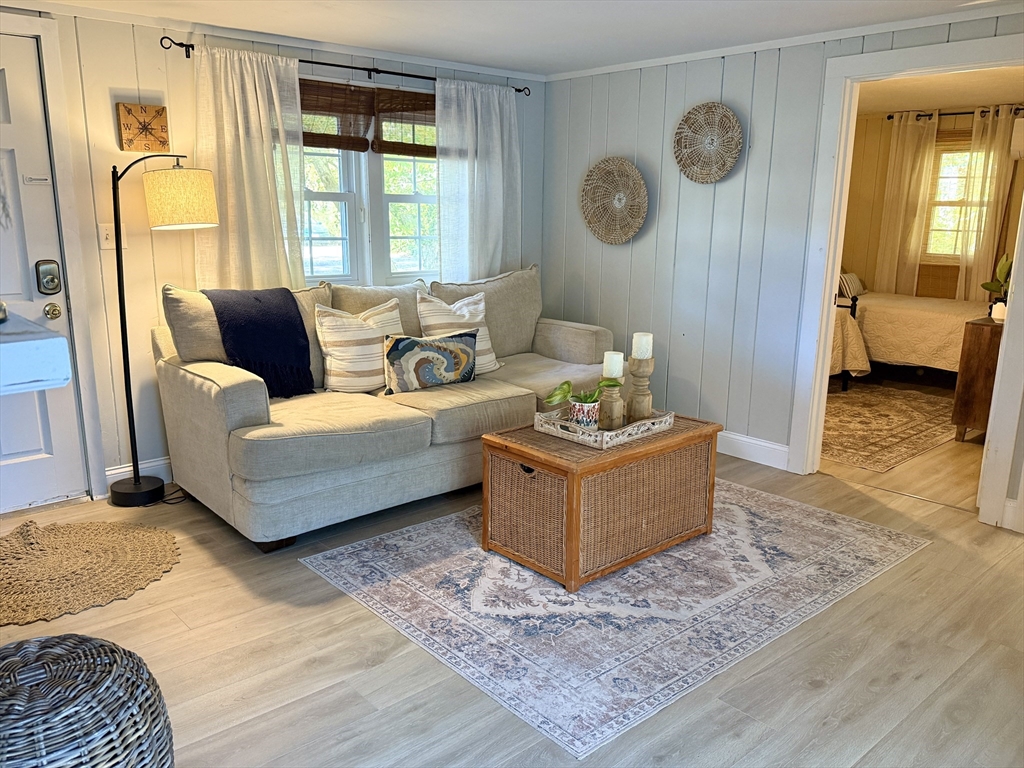 28 Swan Lake Road Yarmouth, MA 02673 - Photo 16 of 19 a living room with furniture and a window