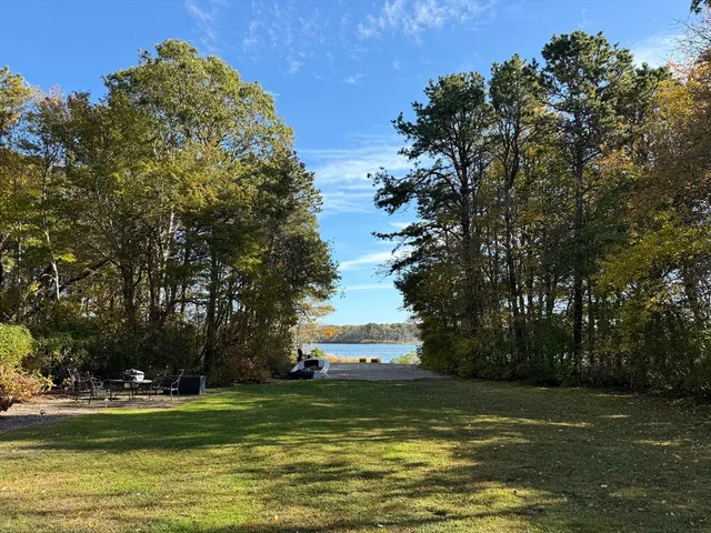 a view of a large body of water with a building in the background