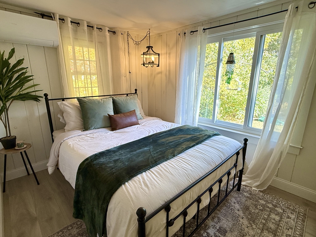28 Swan Lake Road Yarmouth, MA 02673 - Photo 6 of 19 a bedroom with a bed and a window