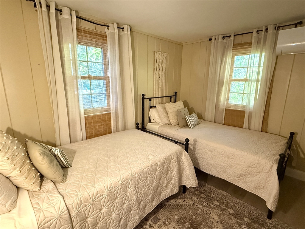 28 Swan Lake Road Yarmouth, MA 02673 - Photo 7 of 19 a bedroom with a bed and a window