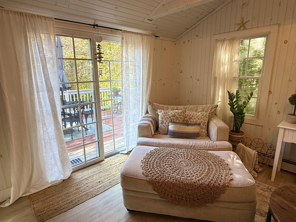 28 Swan Lake Road Yarmouth, MA 02673 - Photo 9 of 19 a bedroom with a large bed and a large window