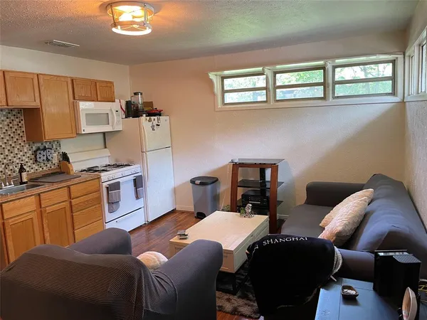 a view of a kitchen sink and a window