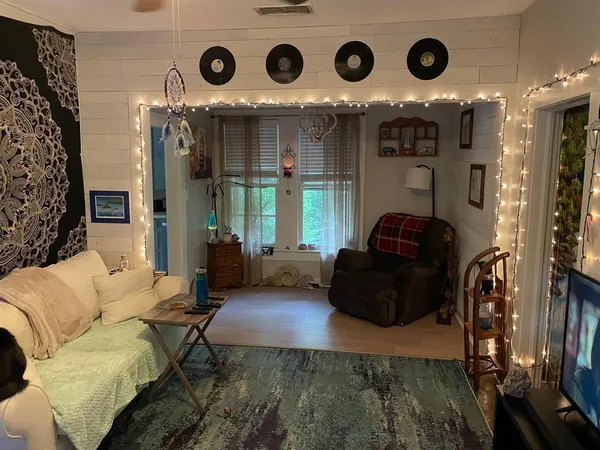 a bedroom with a bed and a tv