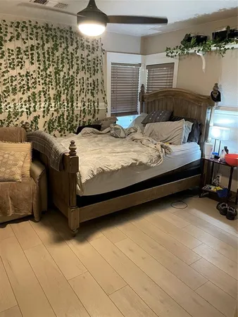 a kitchen with a sink and a stove next to a white cabinet
