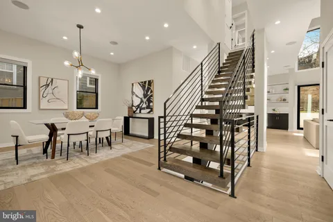 a view of a room with lots of furniture and lots of furniture