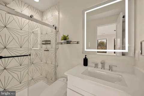 a spacious bedroom with a bed and window