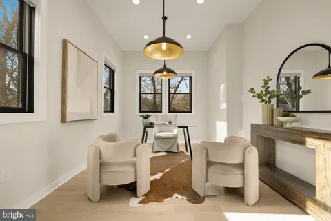 a living room with furniture a window and a table