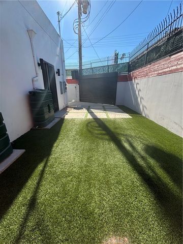 a view of a backyard of the house