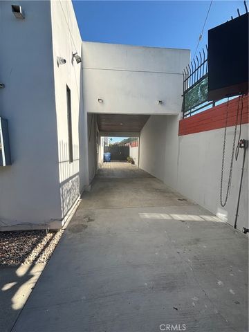 a view of a room with wooden floor and a fireplace