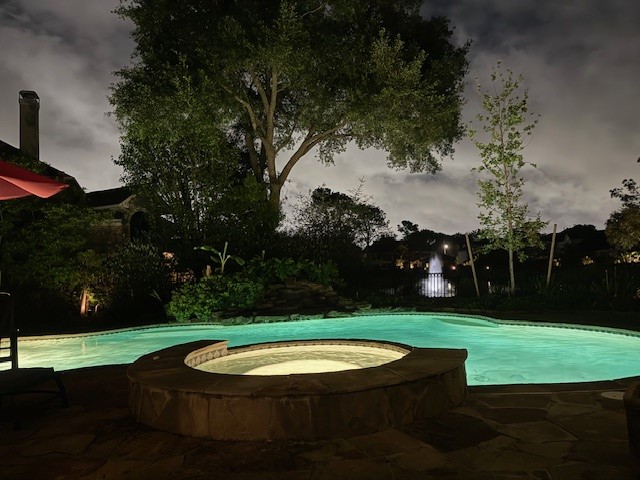 12711 Waterside Way Houston, TX 77041 - Photo 48 of 48 Evening view of pool and lake fountain.