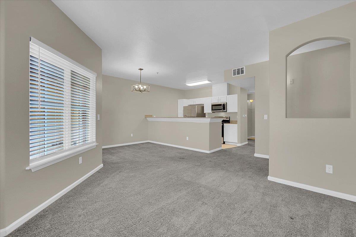 4200 East Commerce, Unit 1121 Sacramento, CA 95834 - Photo 13 of 24 a view of a kitchen with furniture and a kitchen
