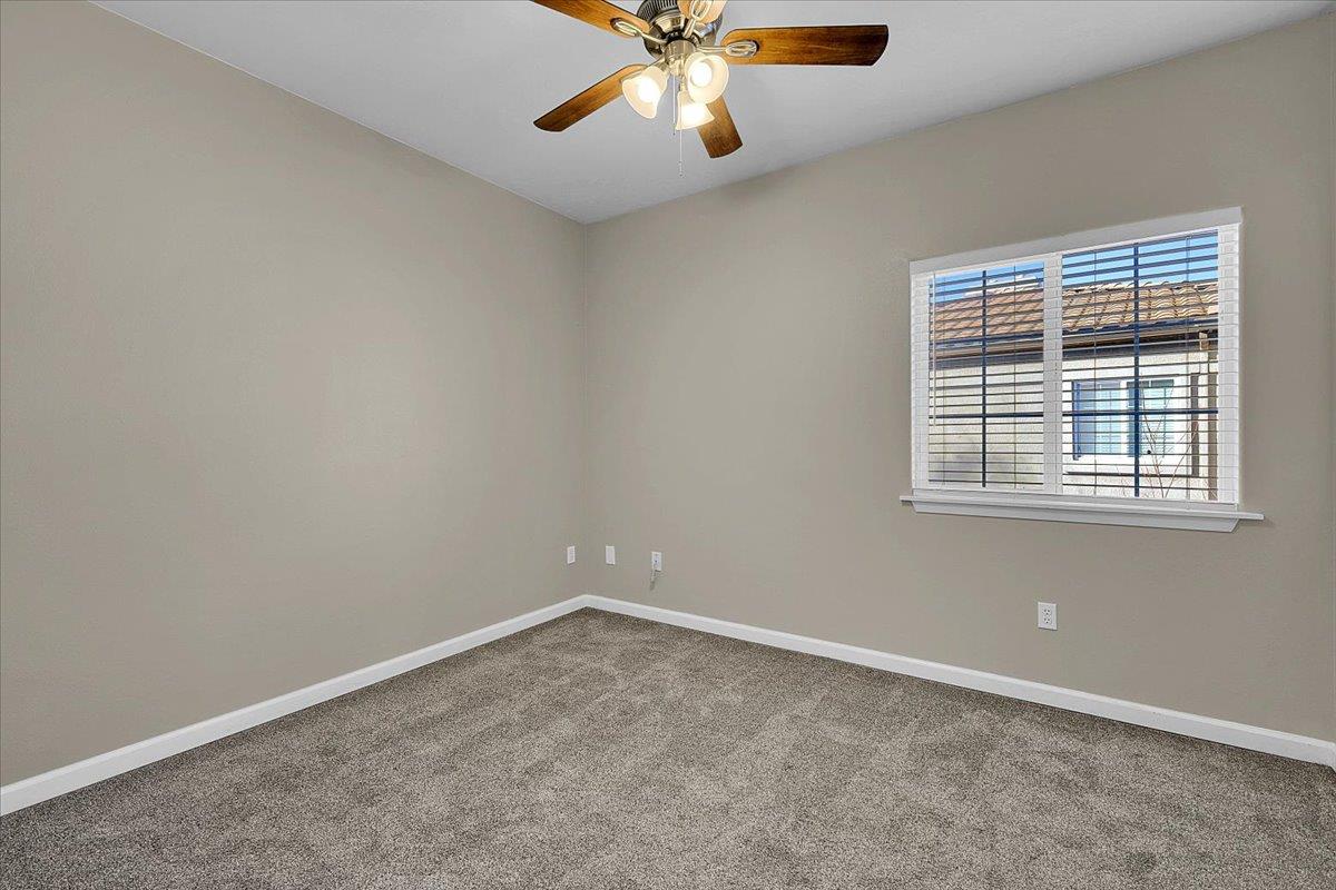 4200 East Commerce, Unit 1121 Sacramento, CA 95834 - Photo 16 of 24 an empty room with windows and fan