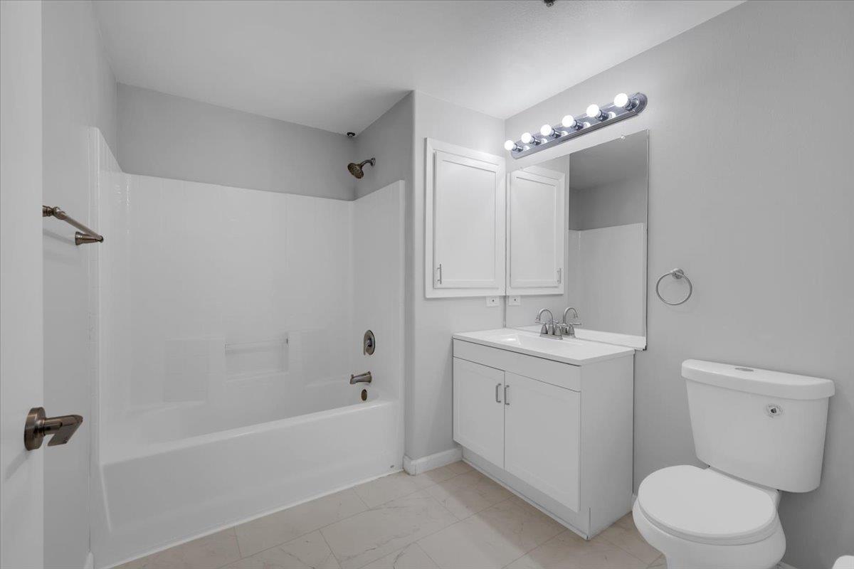 4200 East Commerce, Unit 1121 Sacramento, CA 95834 - Photo 18 of 24 a bathroom with a sink a toilet and shower