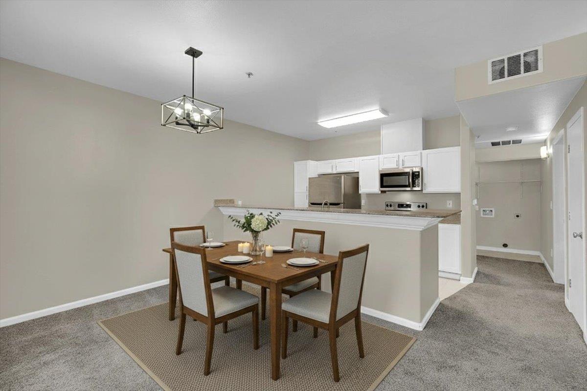 4200 East Commerce, Unit 1121 Sacramento, CA 95834 - Photo 7 of 24 a view of a dining room and chairs