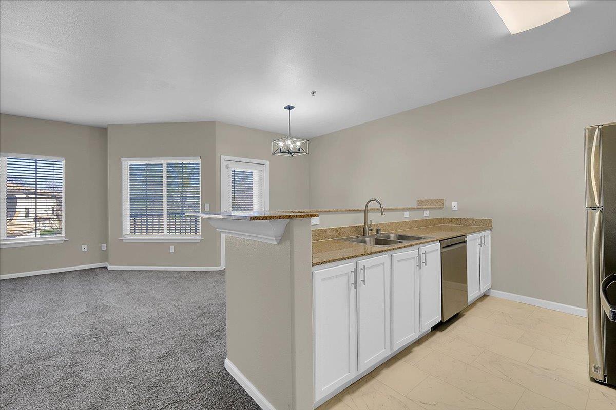 4200 East Commerce, Unit 1121 Sacramento, CA 95834 - Photo 10 of 24 a kitchen that has a lot of cabinets in it