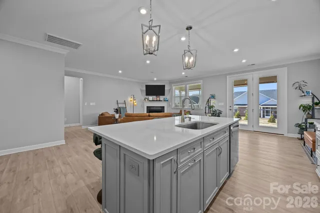 a living room with furniture fireplace and window