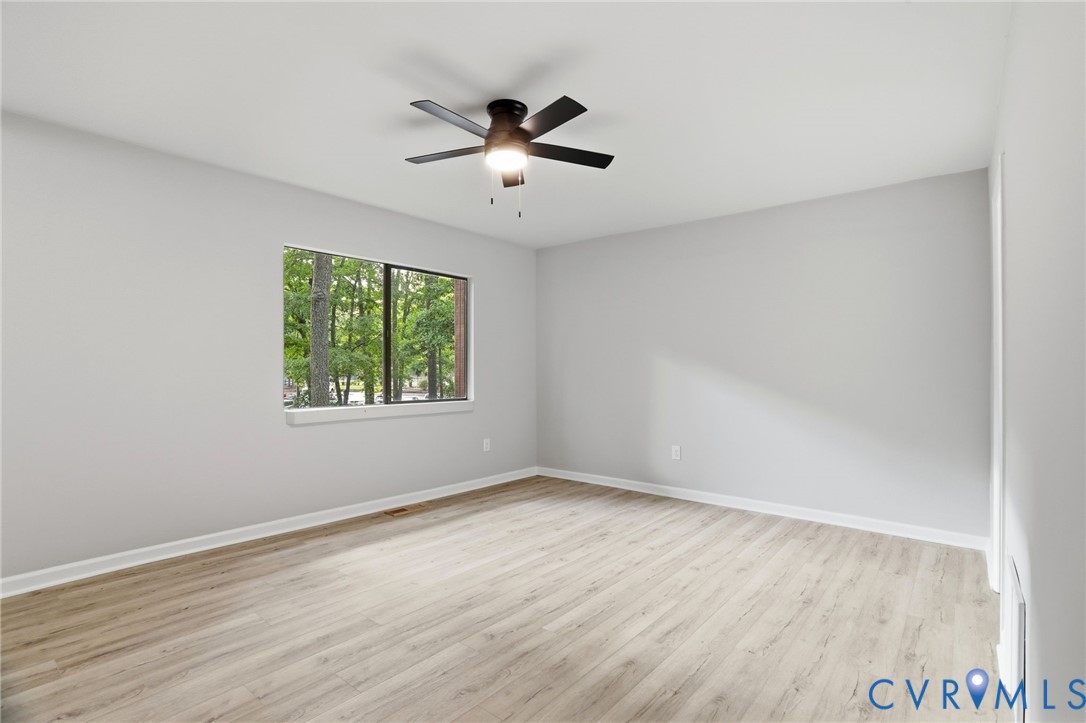 11735 South Briar Patch Drive Midlothian, VA 23113 - Photo 20 of 48 wooden floor in an empty room with a window