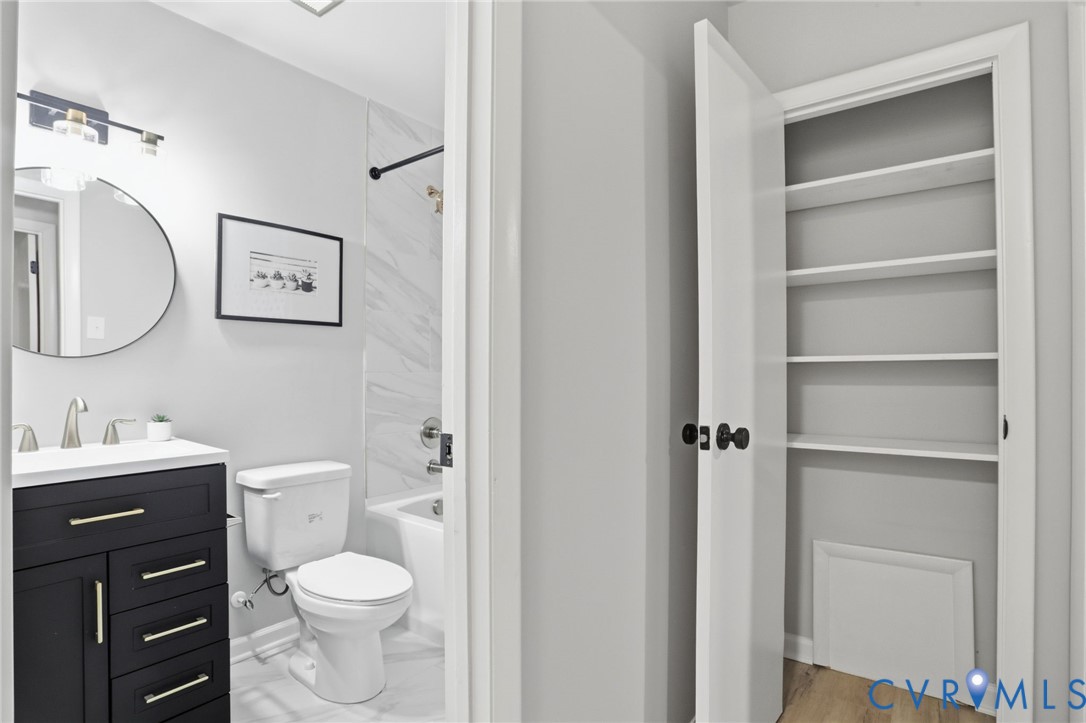 11735 South Briar Patch Drive Midlothian, VA 23113 - Photo 27 of 48 a bathroom with a toilet sink vanity and mirror