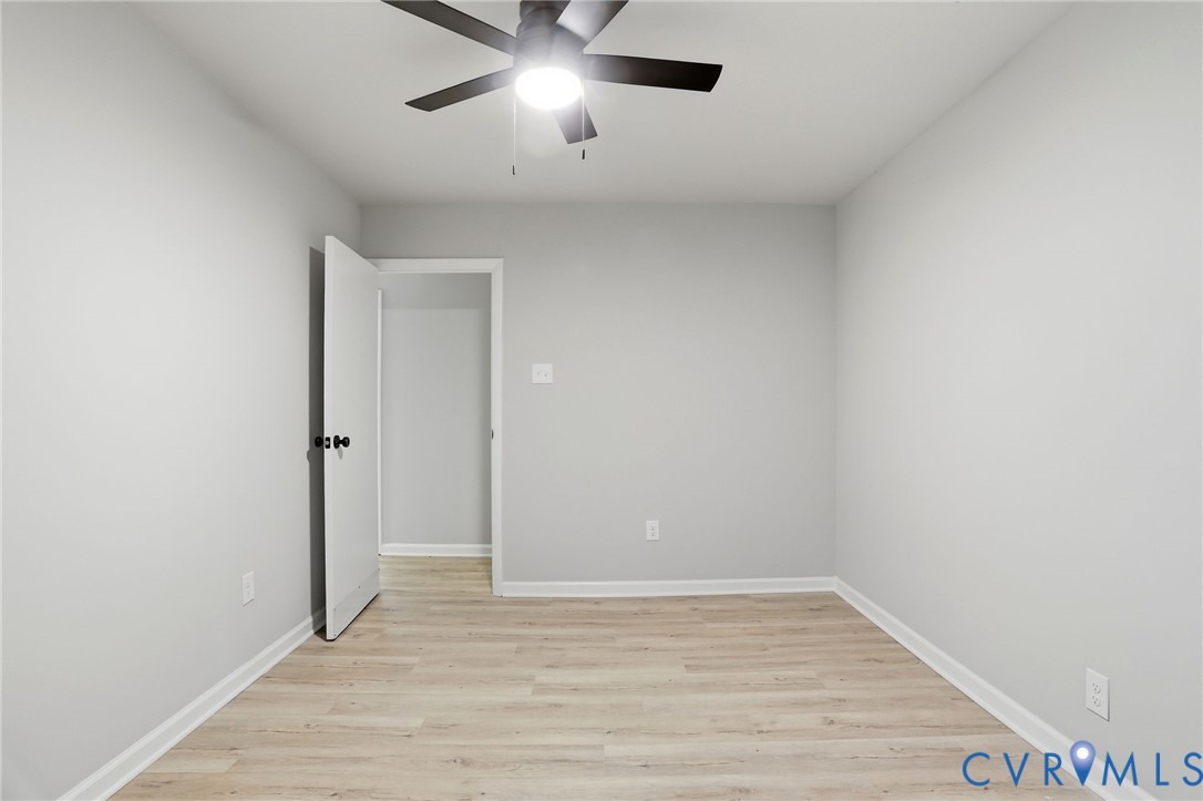 11735 South Briar Patch Drive Midlothian, VA 23113 - Photo 31 of 48 a view of an empty room with wooden floor and a window