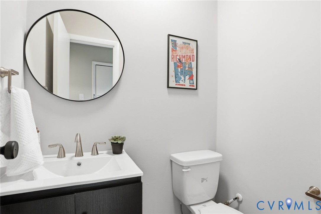 11735 South Briar Patch Drive Midlothian, VA 23113 - Photo 32 of 48 a bathroom with a toilet a sink and a mirror