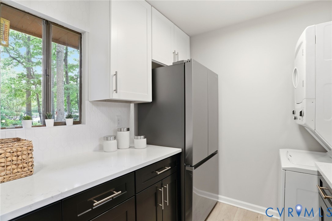 11735 South Briar Patch Drive Midlothian, VA 23113 - Photo 6 of 48 a kitchen with stainless steel appliances a sink a refrigerator and a window