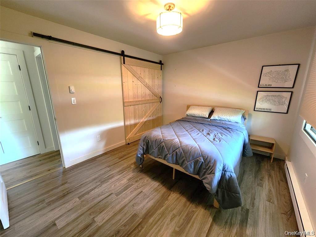 53 Lake Pleasant Road Staatsburg, NY 12580 - Photo 20 of 34 a bedroom with a bed and a mirror