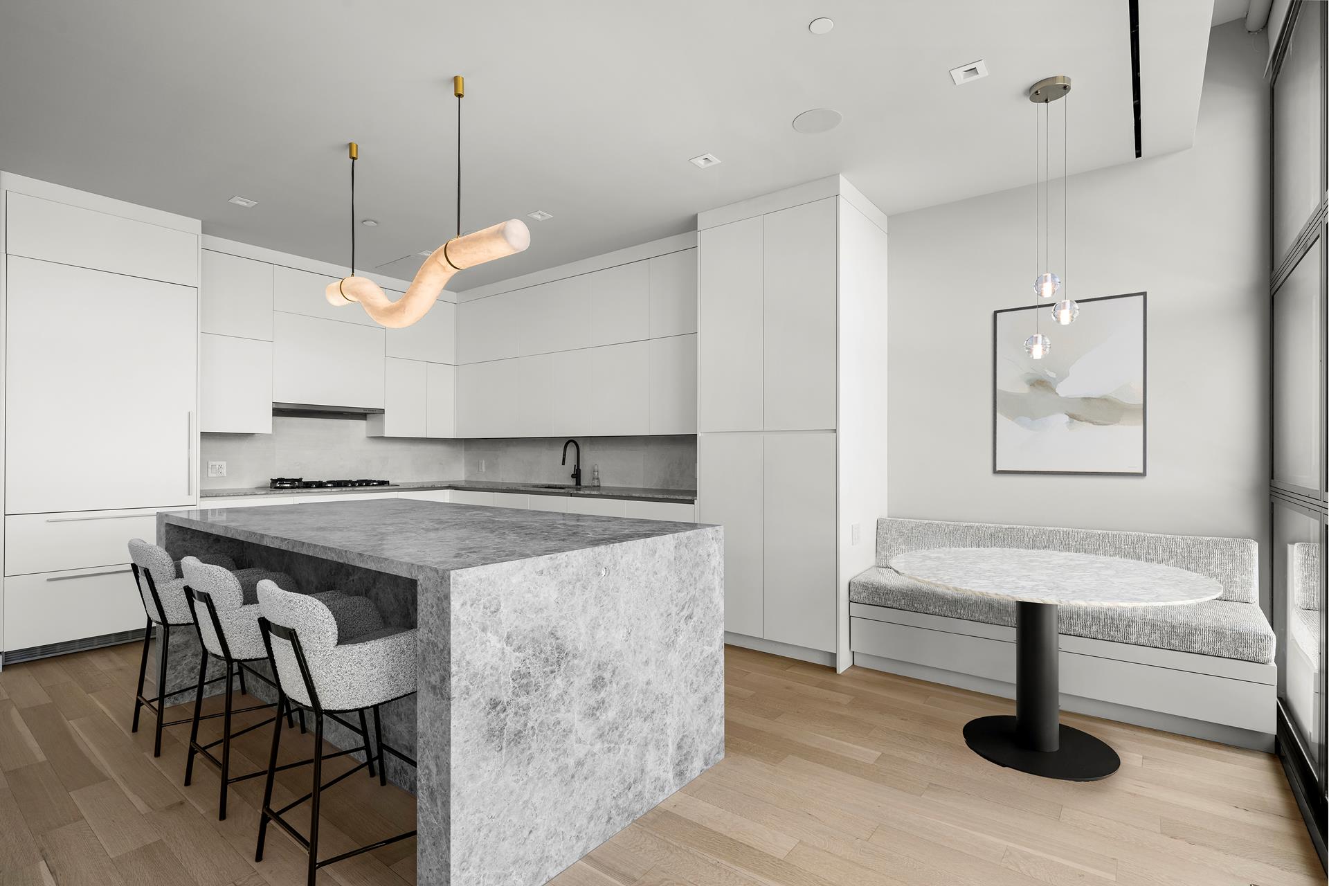 290 West Street, Unit 2B Manhattan, NY 10013 - Photo 5 of 14 a kitchen with a table chairs and wooden floor