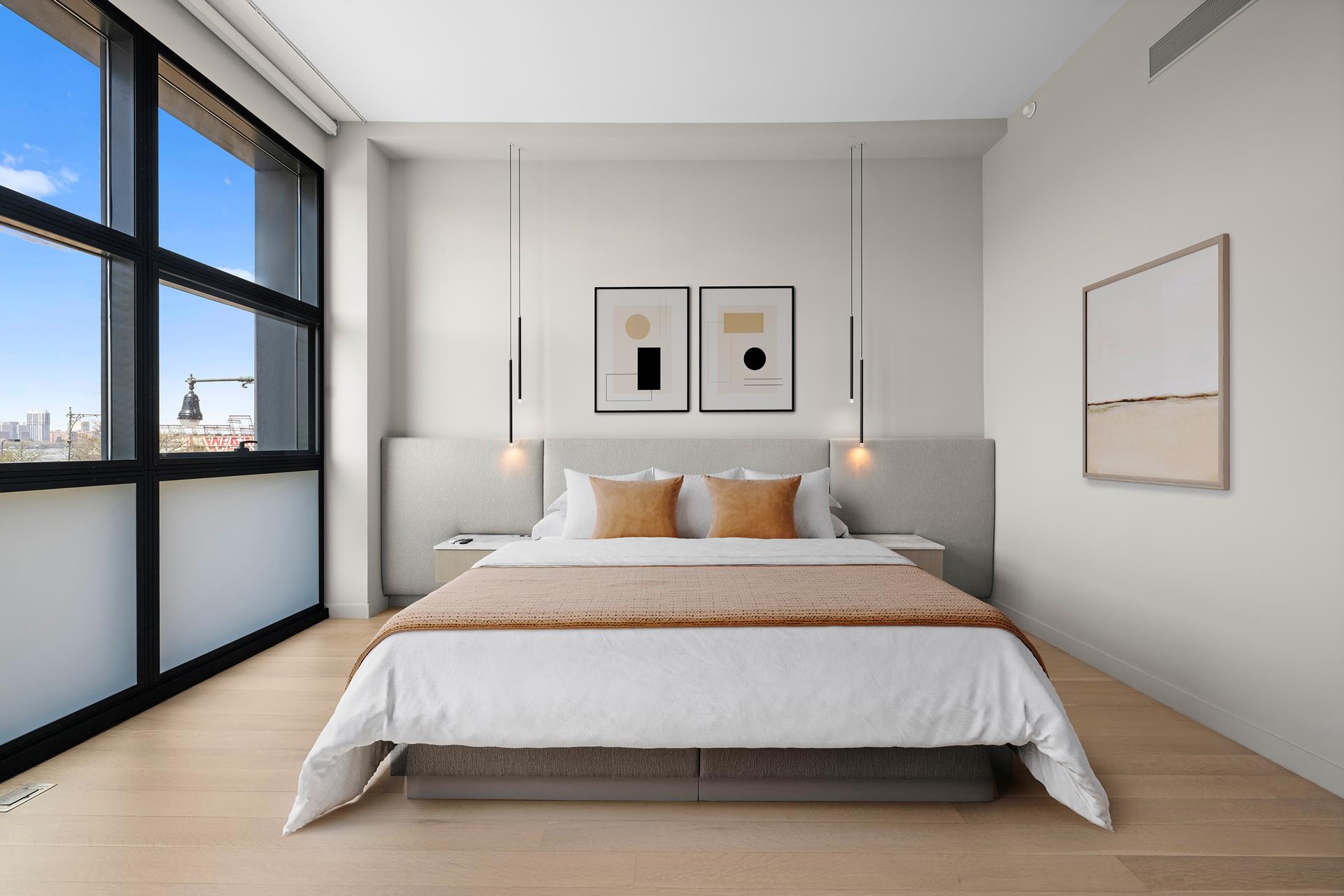 290 West Street, Unit 2B Manhattan, NY 10013 - Photo 8 of 14 a bed sitting in a bedroom next to a window