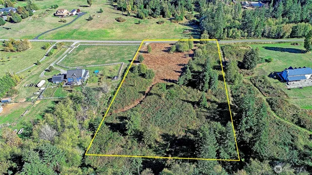 an aerial view of a houses with outdoor space