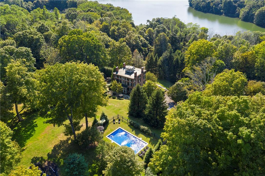 45 Cross River Road Pound Ridge, NY 10576 - Photo 1 of 1 an aerial view of a house with a yard and lake view