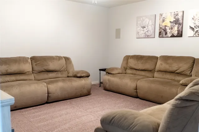 a living room with furniture and a couch