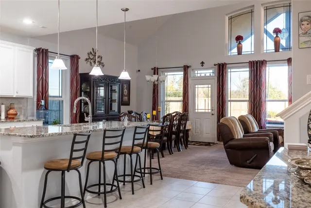 a view of a dining room with furniture chandelier and a chandelier