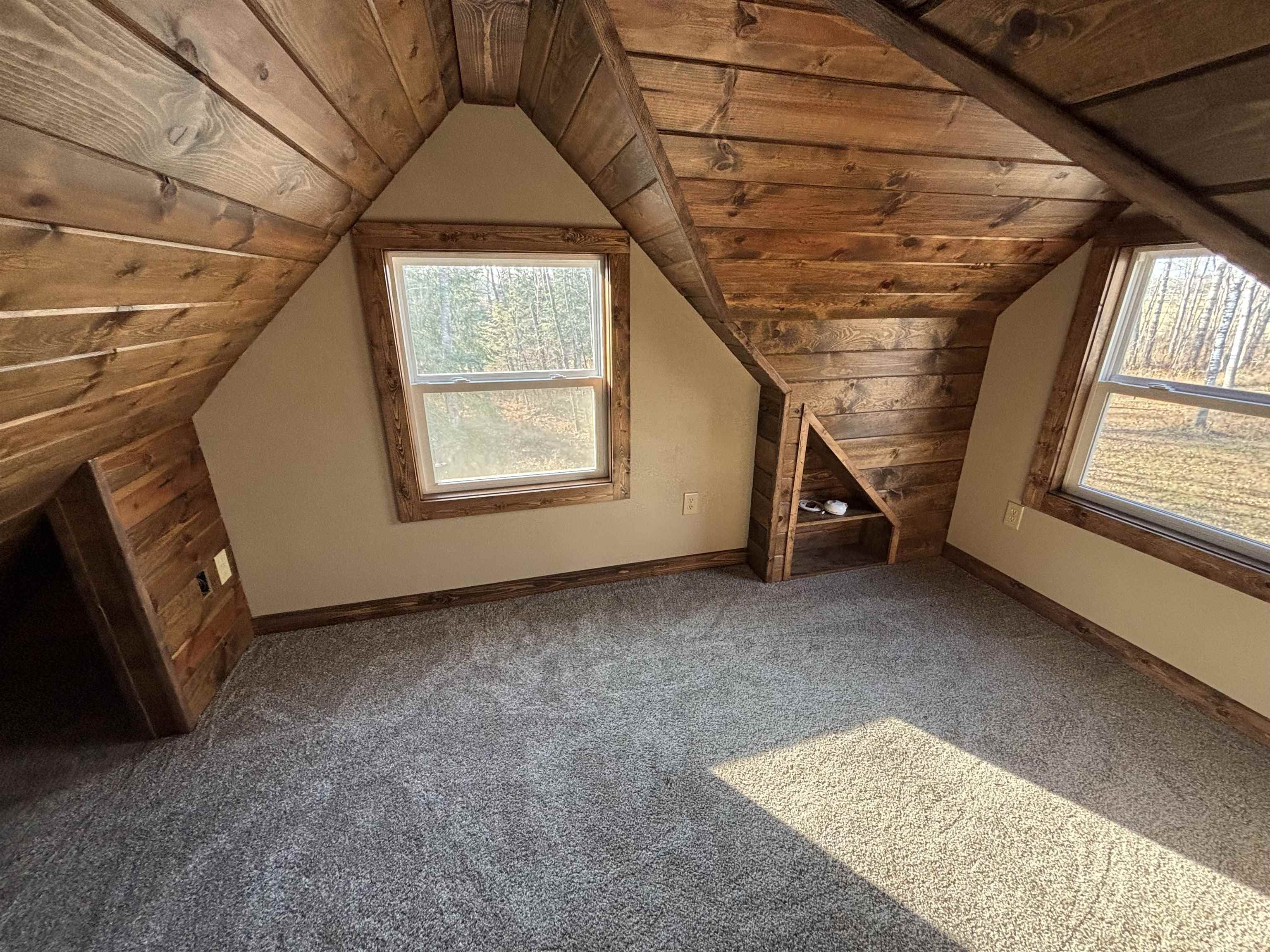 3746 South Hughes Road Hibbing, MN 55746 - Photo 8 of 10 Bonus room featuring wood ceiling, lofted ceiling, and carpet floors