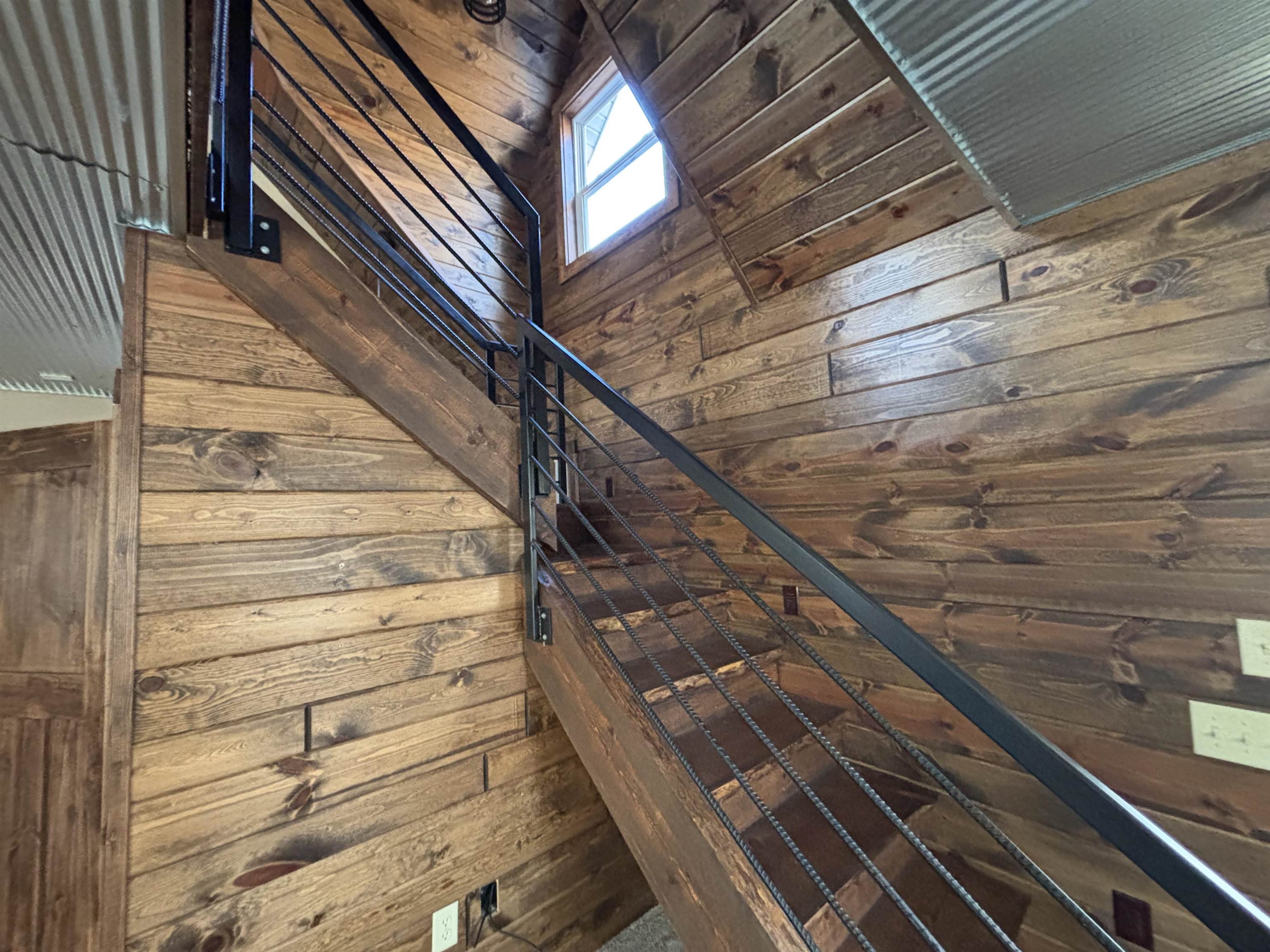 3746 South Hughes Road Hibbing, MN 55746 - Photo 10 of 10 Stairway featuring wood ceiling and wood walls
