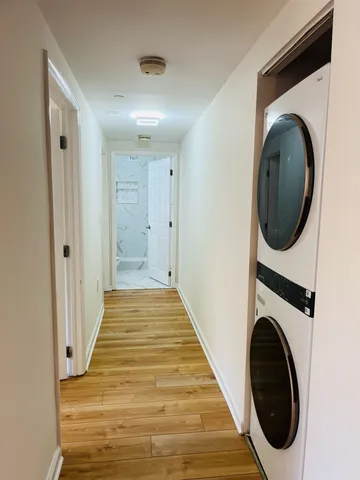 a view of a hallway with washer and dryer