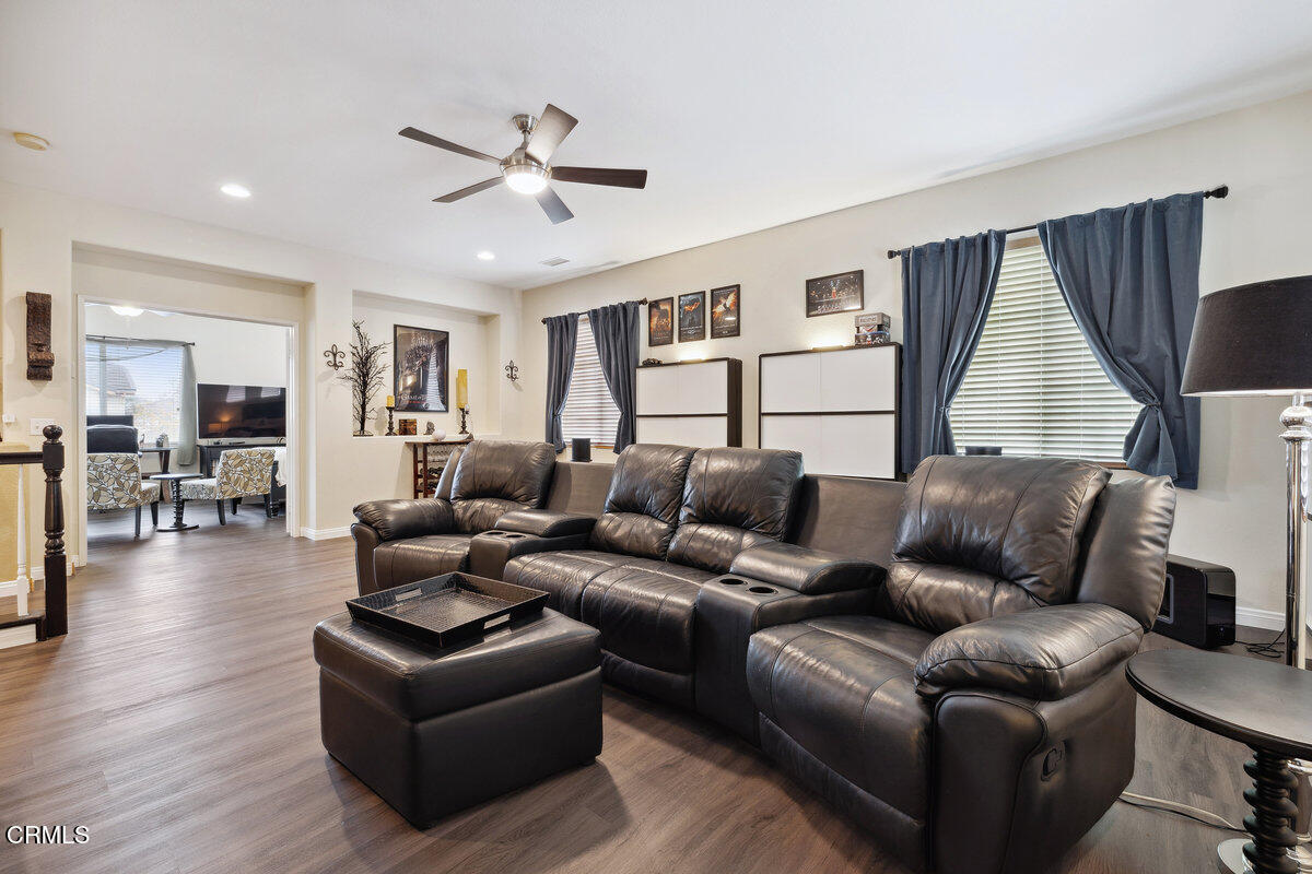 76 Orient Street Fillmore, CA 93015 - Photo 18 of 34 a living room with furniture ceiling fan and a wooden floor