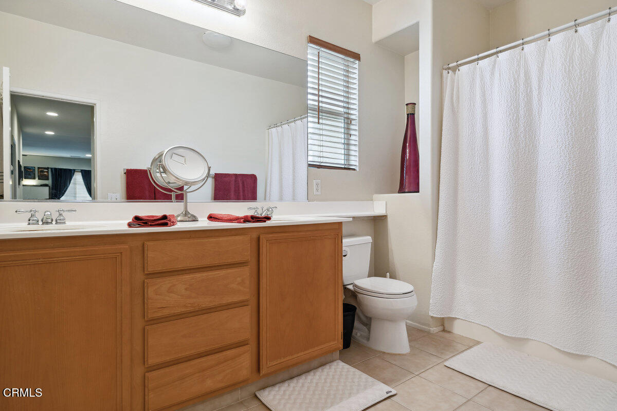 76 Orient Street Fillmore, CA 93015 - Photo 28 of 34 a bathroom with a toilet sink and mirror