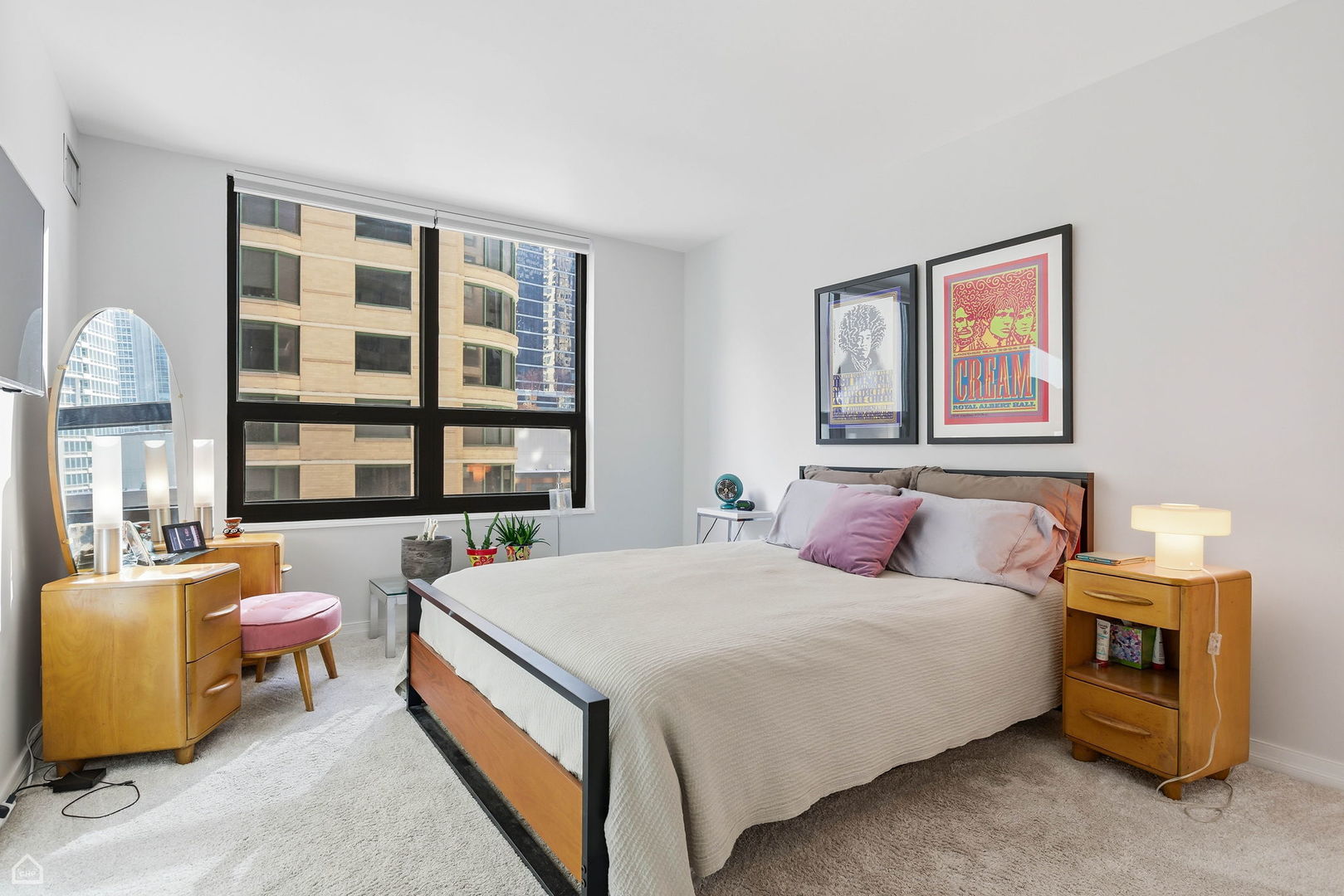 401 East Ontario Street, Unit 710 Chicago, IL 60611 - Photo 16 of 36 a bedroom with a bed and a large window