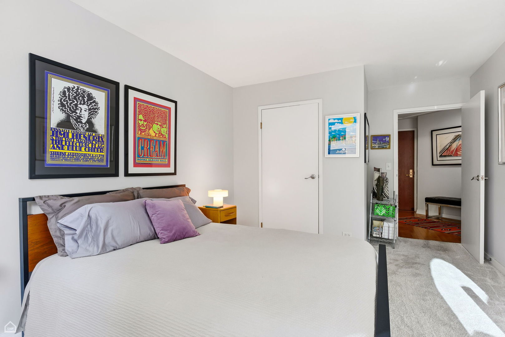 401 East Ontario Street, Unit 710 Chicago, IL 60611 - Photo 19 of 36 a bedroom with a bed and a painting on the wall