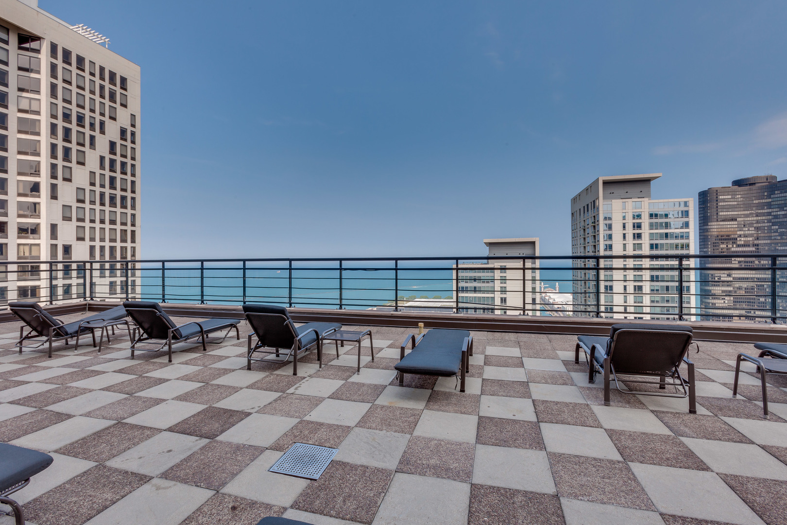 401 East Ontario Street, Unit 710 Chicago, IL 60611 - Photo 25 of 36 a view of a terrace with chairs